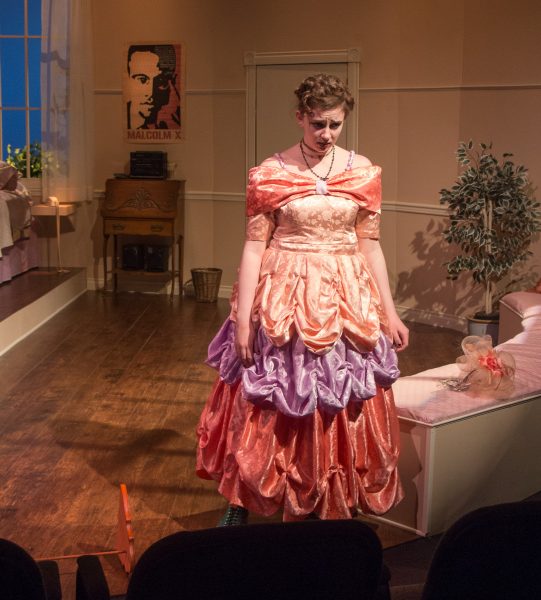 An image from the production of 'Five Women Wearing the Same Dress' featuring Sarah Williams.