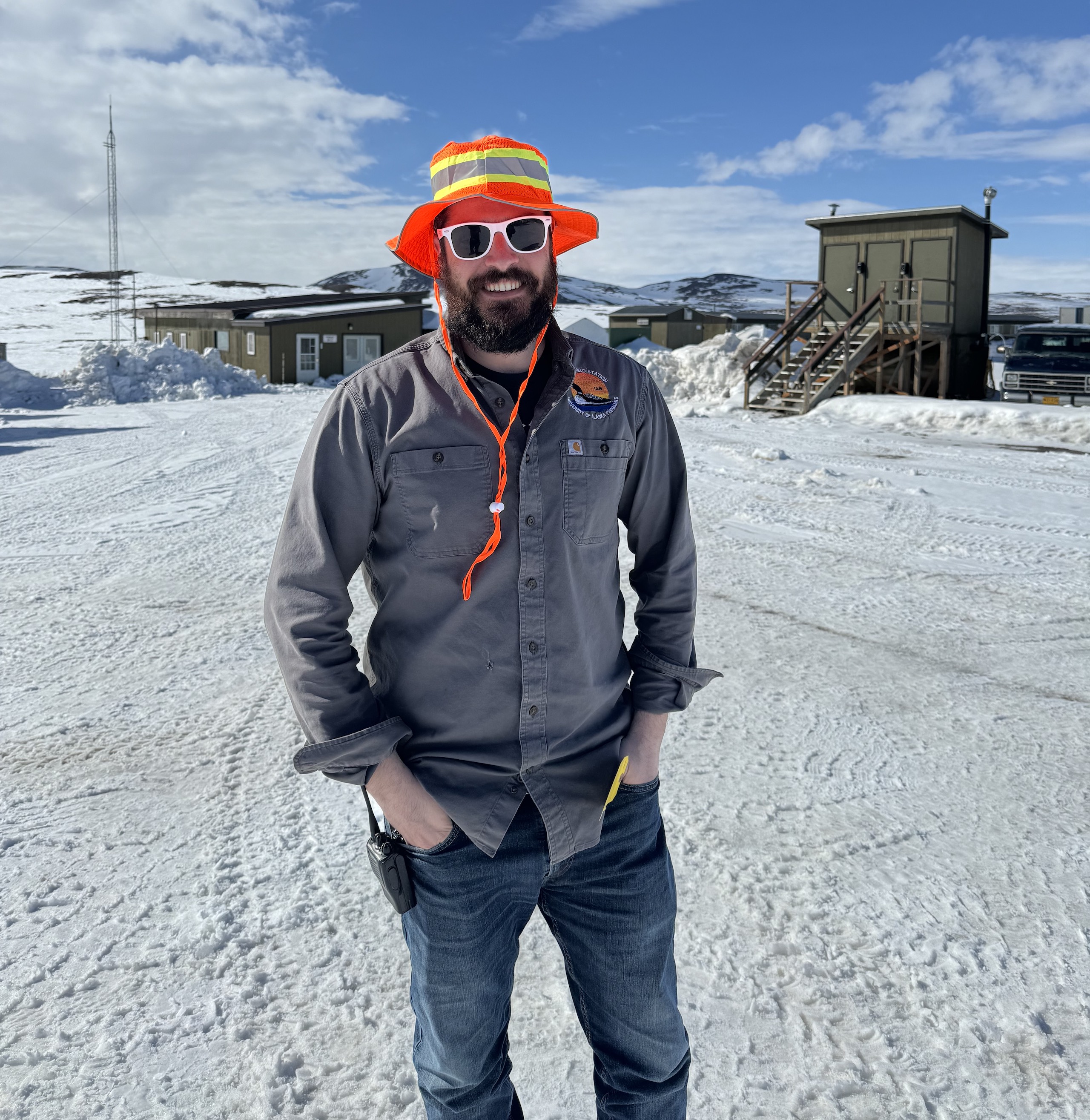 Safety Coordinator and lead EMT Scott Filippone demonstrates proper protective gear on a sunny spring day at Toolik Field Station.