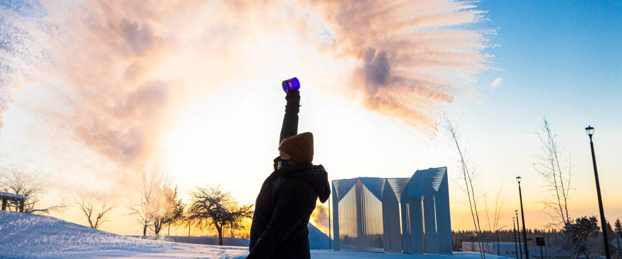 A student throws a cup of water into the air at -40 degrees