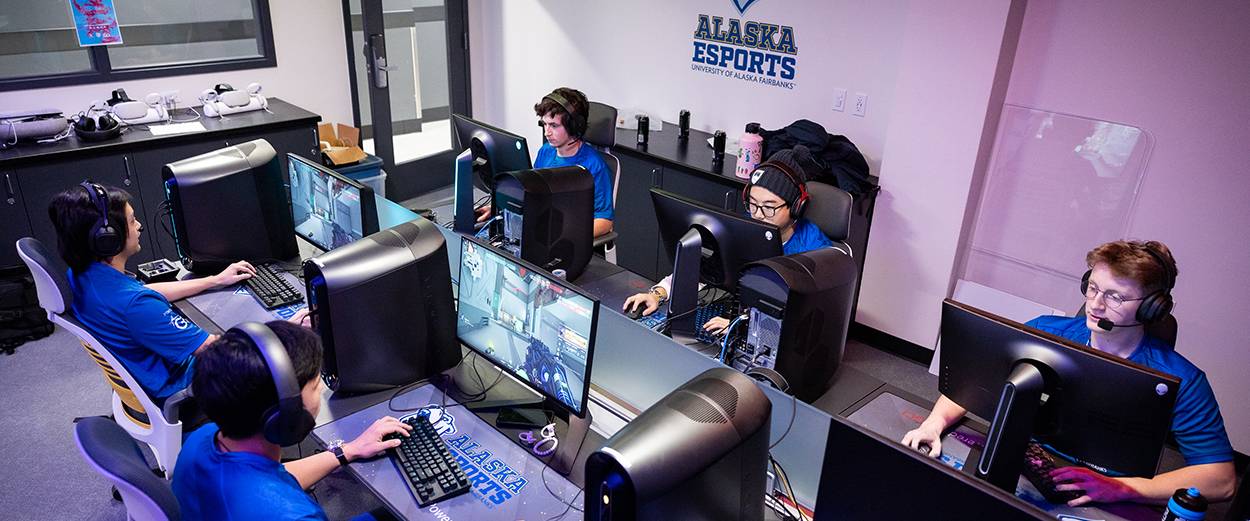 A UAF team competes in the Alaska Esports Center PC gaming area