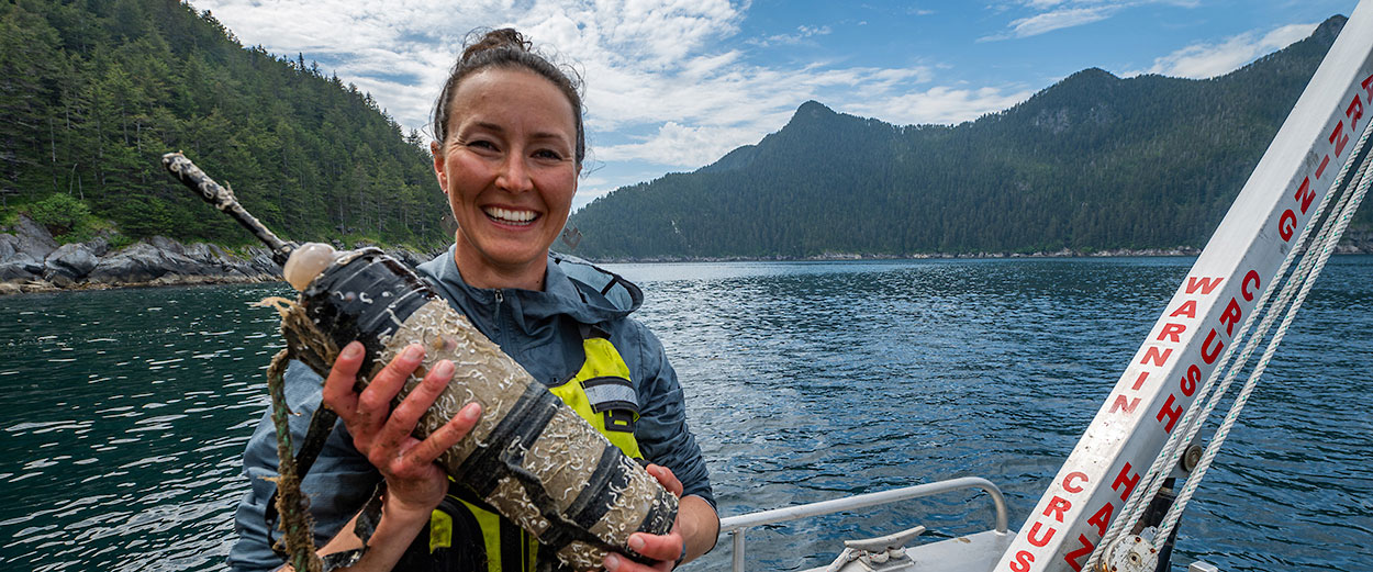 Hannah Myers collects her hydrophones after they've been sitting on the ocean floor recording Killer Whale calls for the last 12 months.